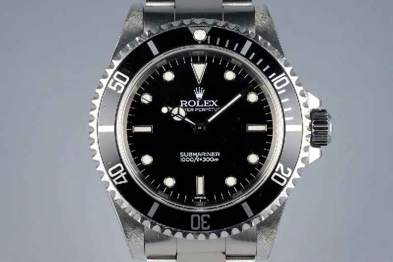 Rolex two-tone stainless steel and gold -1999 Rolex Submariner 14060