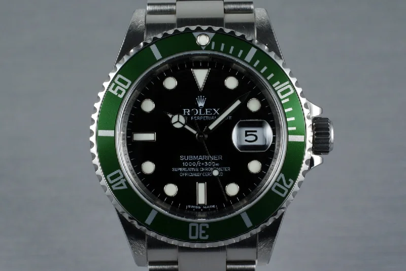 Rolex GMT-Master II with black dial -2007 Rolex Green Submariner 16610 with Box and Papers