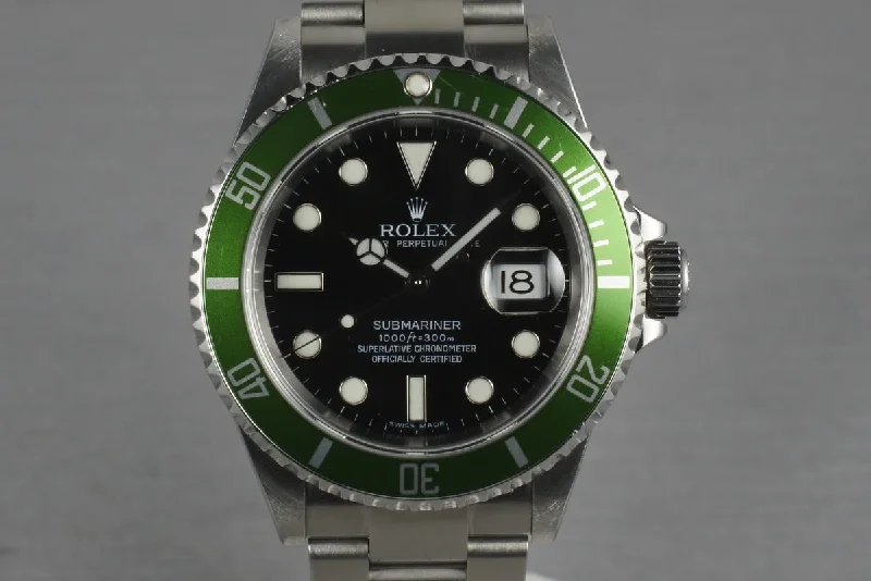 Rolex GMT-Master II with green bezel -2006 Rolex Green Submariner 16610 LV with Box and Papers