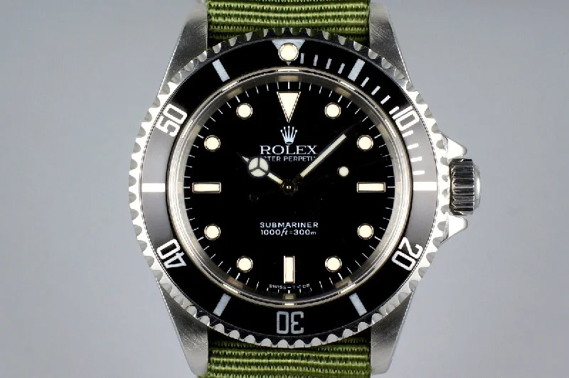 Rolex Day-Date with gold bracelet -1994 Rolex Submariner 14060